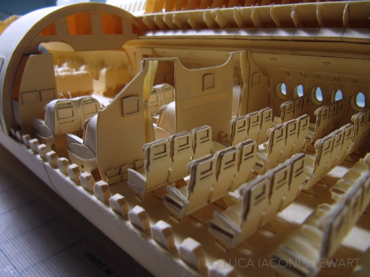 Kid Built An Incredibly Detailed Model Of A Boeing 777 From Cut-Up Paper Folders